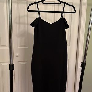 Black dress with off shoulder sleeves and slit